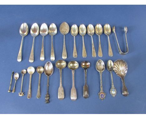 A mixed collection of various spoons to include novelty teaspoons with thistle knops, teaspoons with relief work to the rever