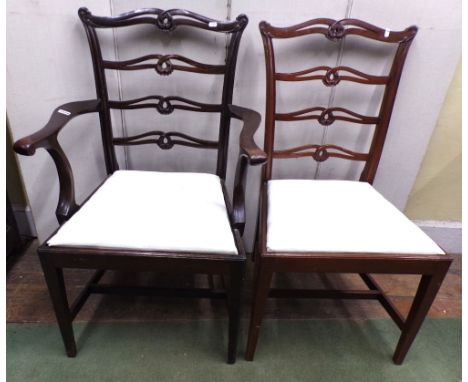 A set of nine (7+2) Chippendale style open ladder back dining chairs on moulded supports, with drop in seats