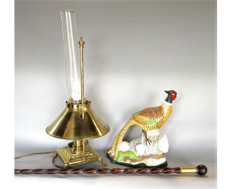 Orient Express brass table lamp, together with a cast iron door porter in the form of a pheasant with painted detail and a wr