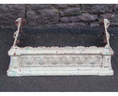 A reclaimed Victorian cast iron sectional wash basin frame, with repeating shell detail and layers of painted finish, togethe