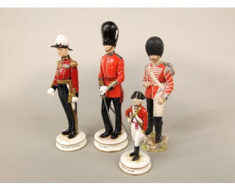 A collection of three limited edition Michael Sutty figures of soldiers including Grenadier Guard, The Queen's Bodyguard and 