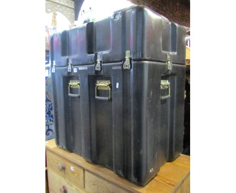 A deep moulded plastic portable trunk with side carrying handles made by Hardigg Cases