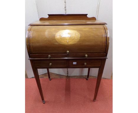 An inlaid Edwardian  mahogany ladies cylinder top writing desk, with marquetry detail, the interior enclosing a simply fitted