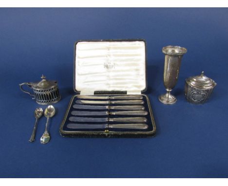 A mixed collection of silver to include a faceted silver caddy with hinged lid and lobed decoration, silver mustard with blue