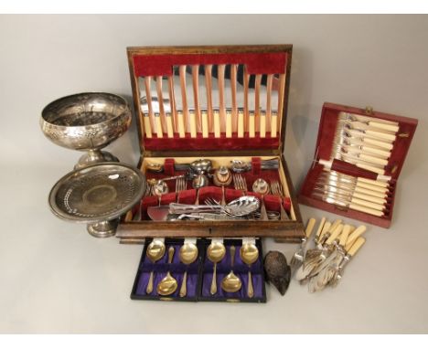 An oak canteen containing a quantity of plated flatware together with further plated wares including a stemmed bowl with styl
