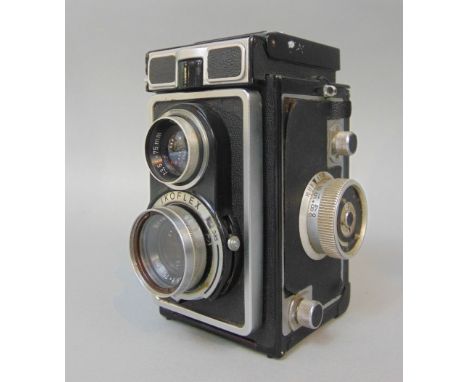 Mamiya C33 Professional vintage camera with twin lenses together with Ikoflex twin lens vintage camera with Novar-Anastigmat 