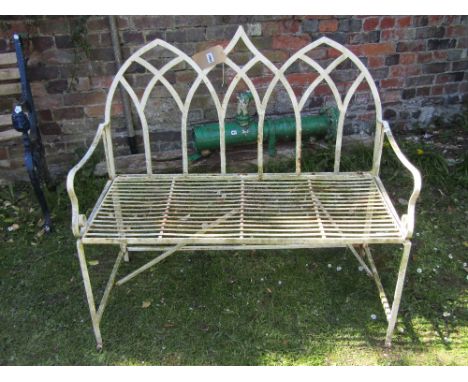 A contemporary Regency style light steel two seat garden bench with pierced gothic tracery back over a strap work seat and op