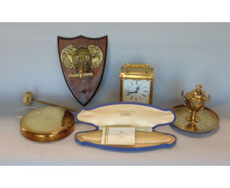 A small quantity of brassware to include a wall hanging novelty gong in the form of an elephant, a carriage clock, a good qua