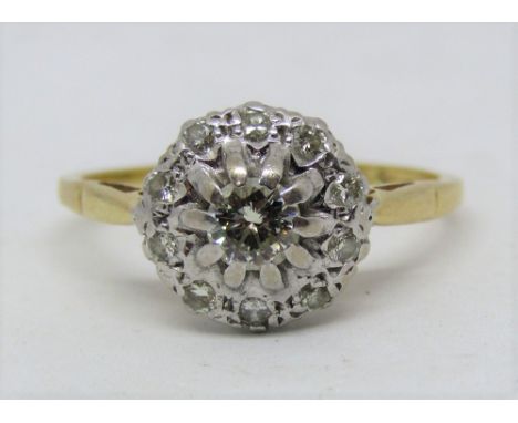 An 18ct diamond halo ring, central stone 0.30cts approx, size R/S, 4g