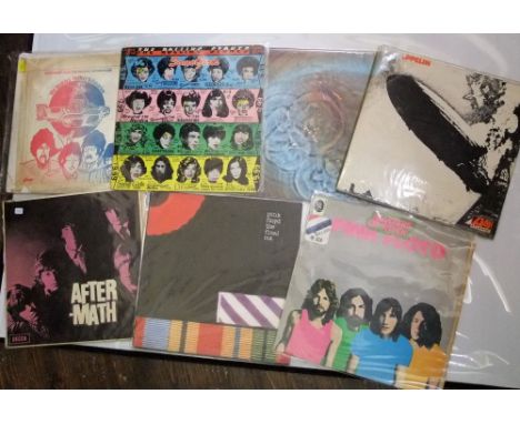 A collection of seven vinyl LPs including The Rolling Stones, Lead Zeppelin, Pink Floyd and the soundtrack from the Beatles -