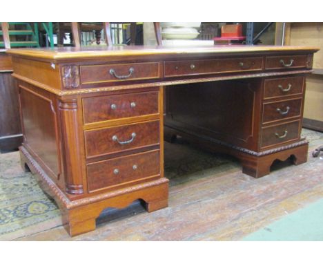 A good quality Georgian style partners writing desk, each side fitted with nine drawers within a moulded framework, the top w