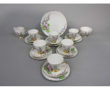 A six place Old Royal Bone China Hollyhock pattern tea service including milk jug, sugar bowl and cake plate