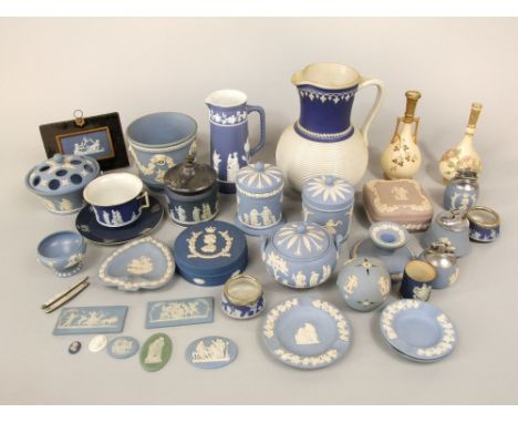 A collection of Wedgwood Jasperwares including various small plaques with classical figure detail, two cylindrical boxes and 