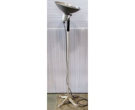 A vintage floorstanding standard lamp, with possibly associated adjustable domed shade, raised on a painted tubular stem and 