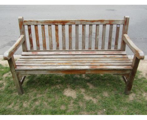 A good quality contemporary Lansdale teak three seat garden bench with slatted seat and back, 5ft long approx complete with p