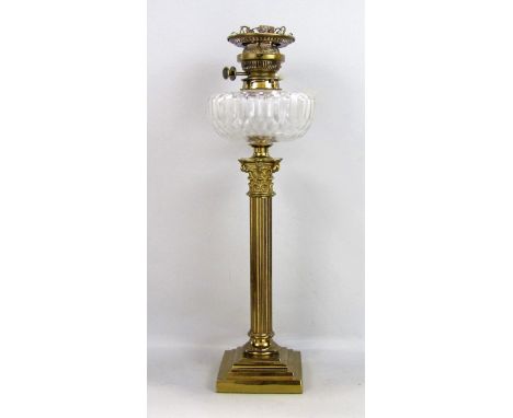 A 19th century oil lamp with cut glass font, raised on a brass stepped column with ionic capital