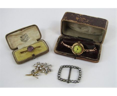 Mixed lot to include a 9ct lug head wristwatch with concertina strap, 9ct brooch set with a faceted amethyst and a paste set 