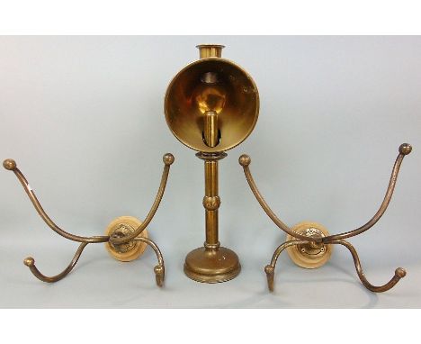 A mixed metalware lot to include two brass wall fitted coat/hat hooks, together with a brass table lamp (3)