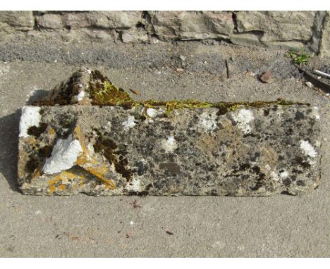 A reclaimed limestone apex ridge tile 