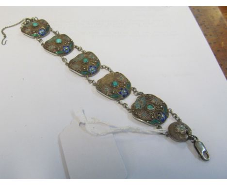 A Chinese white metal filigree bracelet with turquoise and enamel