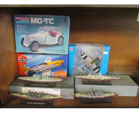 A Corgi die-cast model plane (boxed), Airfix P - 51D Mustand (boxed), four Atlas model ships (two boxed) and a model tank (i.