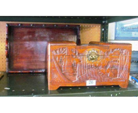A carved oriental sewing box and a two handled tray