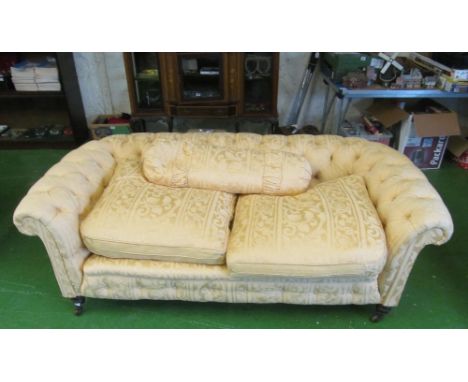 An Edwardian Chesterfield style button upholstered settee