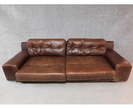 A vintage style brown leather button back two seater sofa retailed by Habitat. H.65 W.236 D.90cm