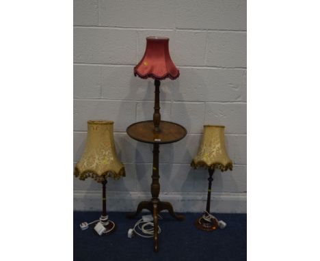 A PAIR OF EDWARDIAN MAHOGANY COLUMN TABLE LAMPS with fabric shades (one lamp with repair to base and damaged light fitting) t