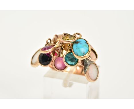 A YELLOW METAL MULTI-GEMSTONE RING, the plain polished wide shank, suspends nine drops containing various collet mounted gems
