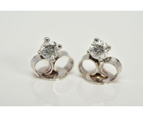 A PAIR OF 9CT WHITE GOLD DIAMOND EARRINGS, each designed with a claw set round brilliant cut diamond, total estimated diamond
