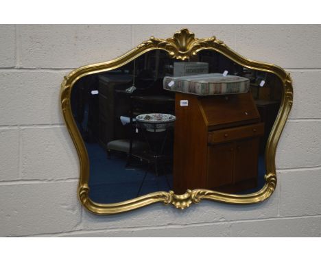 A MODERN FOLIATE GILT FRAMED OVERMANTEL MIRROR, 103cm x 77cm