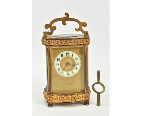 A SMALL BRASS GLASS SIDED CARRIAGE CLOCK, brass front signed L.N. Hobday, Birmingham, enamel Arabic chapter ring, measuring a