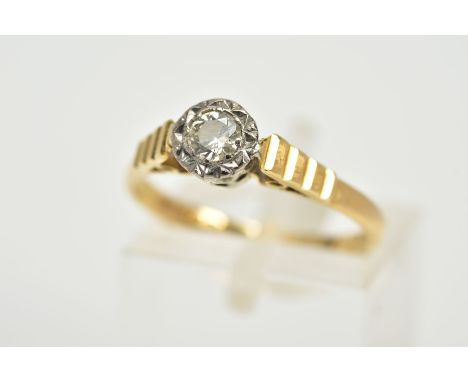 AN 18CT GOLD SINGLE STONE DIAMOND RING, designed with an illusion set round brilliant cut diamond, total estimated diamond we