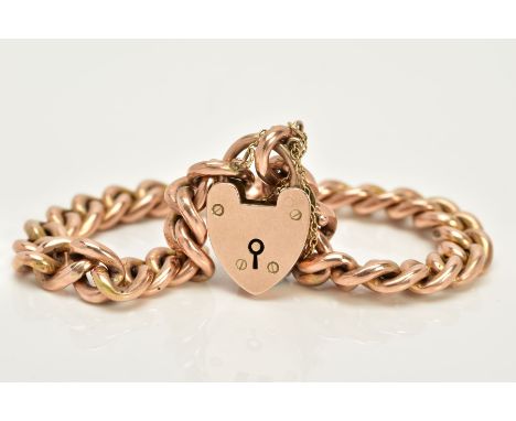A YELLOW METAL CHARM BRACELET, the hollow curb link bracelet, each link stamped 9c, approximate width 7.4mm, fitted to a hear