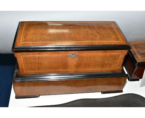 A LATE 19TH CENTURY WALNUT, EBONISED AND SATINWOOD BANDED MERMOD FRERES MUSIC BOX PLAYING SIX TUNES ON EACH OF FOUR CYLINDERS
