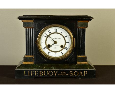 ADVERTISING INTEREST: a late 19th century Junghans faux black slate and marble effect mantel clock, the white enamel dial wit