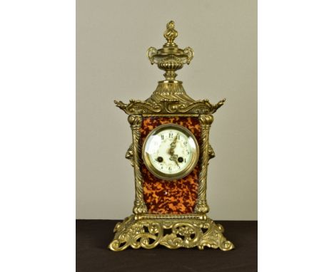 A LATE 19TH CENTURY BRASS AND TORTOISESHELL FRENCH MANTEL CLOCK, flaming urn finial above a scrolling canopy, lion and swag m