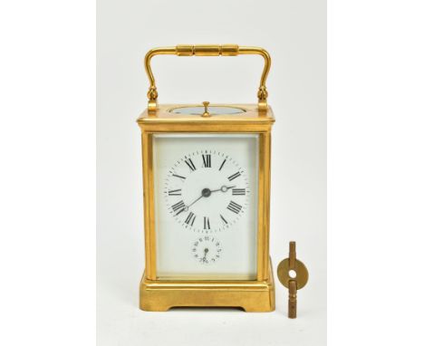 A FRENCH BRASS REPEATER AND ALARM CARRIAGE CLOCK, with circular dial with Roman numerals above the subsidiary dial, striking 