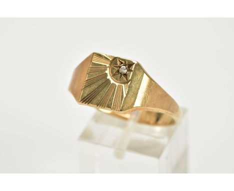 A GENTS 9CT GOLD SIGNET RING, of a square form, featuring an engraved sun set with a circular cut colourless stone assessed a