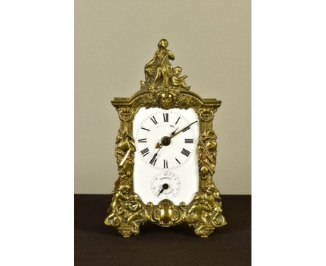 A LATE 19TH CENTURY FRENCH BRASS CASED ALARM MANTEL CLOCK, with figural surmount, the front and back of the case cast with a 