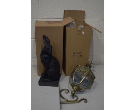 A MODERN BRASSED WALL HANGING LANTERN with glass panels and a wall bracket, together with a resin figure of a hare (with boxe