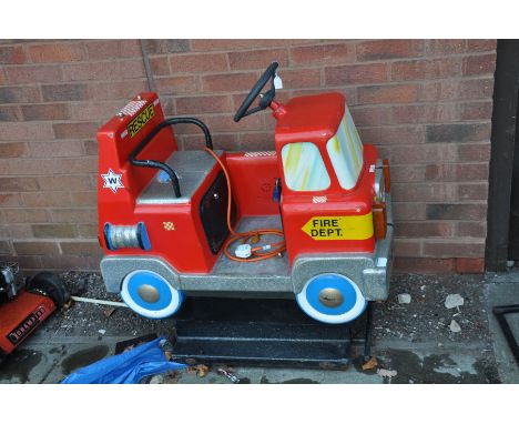 A COIN OPERATED CHILDS RIDE ON FIRE ENGINE fibre glass in construction with 20p coin mechanism, length 90cm x depth 50cm x he