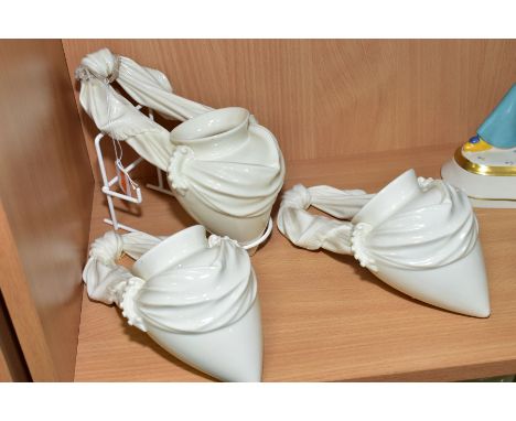 THREE ROYAL WORCESTER WALL POCKETS, modelled as a swag tied amphora shaped vase, pattern No 1155, height 23cm (3)