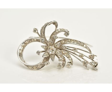 A WHITE METAL FLORAL DIAMOND BROOCH, of openwork floral and foliate design, set with round brilliant cut and single cut diamo