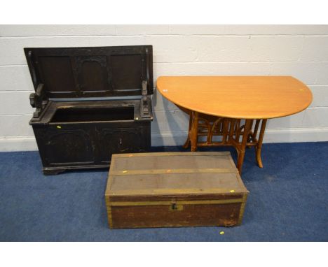 AN OAK MONKS BENCH (sd and losses) together with a teak and bamboo gate leg table and a vintage travelling trunk (3)