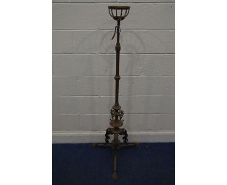 AN EARLY 20TH CENTURY ART NOUVEAU BRASS TELESCOPIC LAMP, with foliate decoration and triple legs, minimum height 149cm x maxi