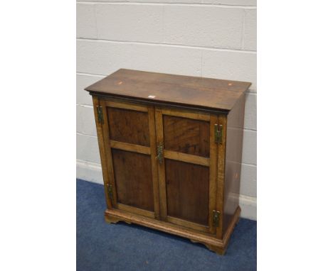 A GEORGIAN OAK TWO DOOR CUPBOARD, with panelled doors enclosing two fixed shelves on bracket feet width 81cm x depth 38cm x h