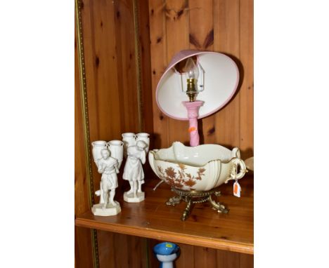 A GROUP OF ROYAL WORCESTER, comprising a blush ivory twin handled bowl, gilt foliage design, gilt metal stand added to base, 