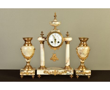 A 19TH CENTURY FRENCH VARIEGATED MARBLE AND GILT METAL CLOCK GARNITURE, the drum shaped dial case surmounted by an urn, the e